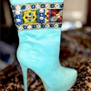 Turquoise suede heeled booties. Brand new. Never been worn.